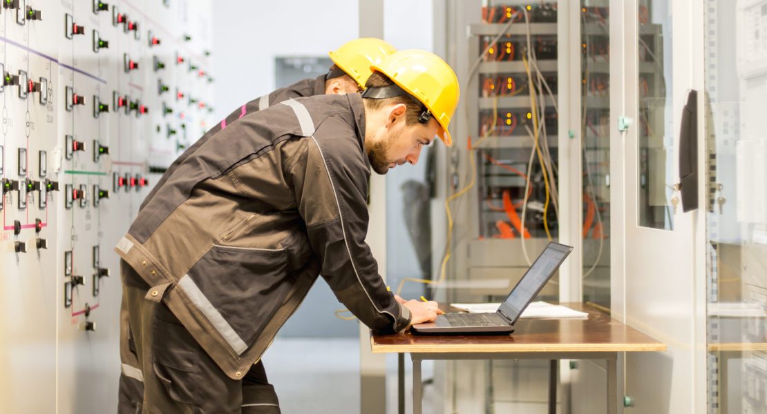 Two,Maintenance,Engineers,Inspect,Relay,Protection,System,With,Laptop,Computer. Two,Maintenance,Engineers,Inspect,Relay,Protection,System,With,Laptop,Computer.